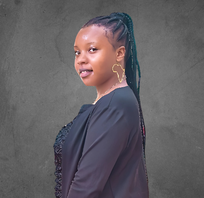 A person with braided hair is wearing an Africa-shaped earring against a textured background.